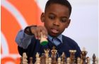 Young child playing chess