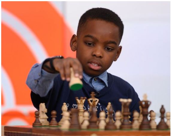 Young child playing chess